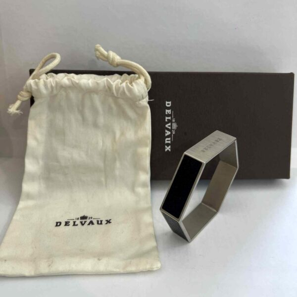 Bracelet DELVAUX octogonal en acier brossé et cuir noir grainé