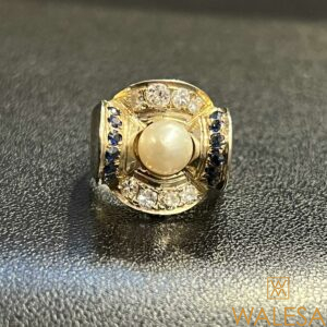 Bague Art Déco en or jaune 18K sertie d’une perle diamants et saphirs